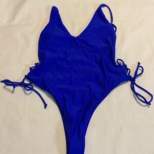 Size small royal blue one piece high cut swimsuit.  Open back
